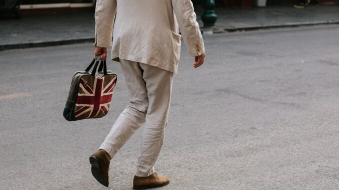 UK Government signs off sweeping AI action plan Photo of a man carrying a bag with the Union Jack flag of the UK as Prime Minister Keir Starmer unveils an AI action plan aiming to harness artificial intelligence technologies to unlock economic potential, transform public services such as the NHS, and more.