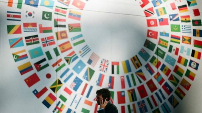 Analysing the geopolitics of generative AI Flags at the World Bank illustrating an article with viewpoints from Boston Consulting Group, or BCG, on how generative AI is reshaping global competition and geopolitics, presenting challenges and opportunities for nations and businesses alike.