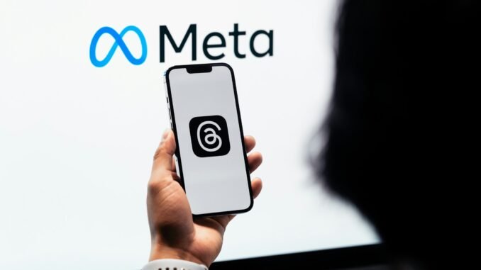 Meta will train AI models using EU user data Person holding a phone displaying the Threads social media platform in front of the Meta logo as the company confirms plans to utilise content shared by its adult users in the EU (European Union) on platforms like Instagram and Facebook to train its AI models.
