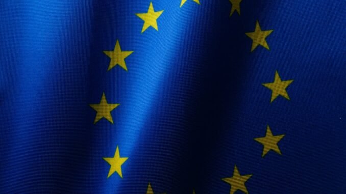 Flag of the EU as the European Commission has seen a flood of interest from companies looking to help create AI Gigafactories across Europe develop and train the next generation of artificial intelligence systems.