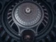 US Capitol dome interior with dramatic lighting showing legislative architecture and political tension